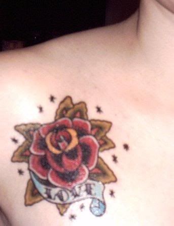 A Reddening Rose in A Creative Tribal Tattoo Design Carved in the Left Front Part of Body of Manis Girl  